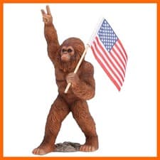 Bigfoot Statue Holding The National Flag,